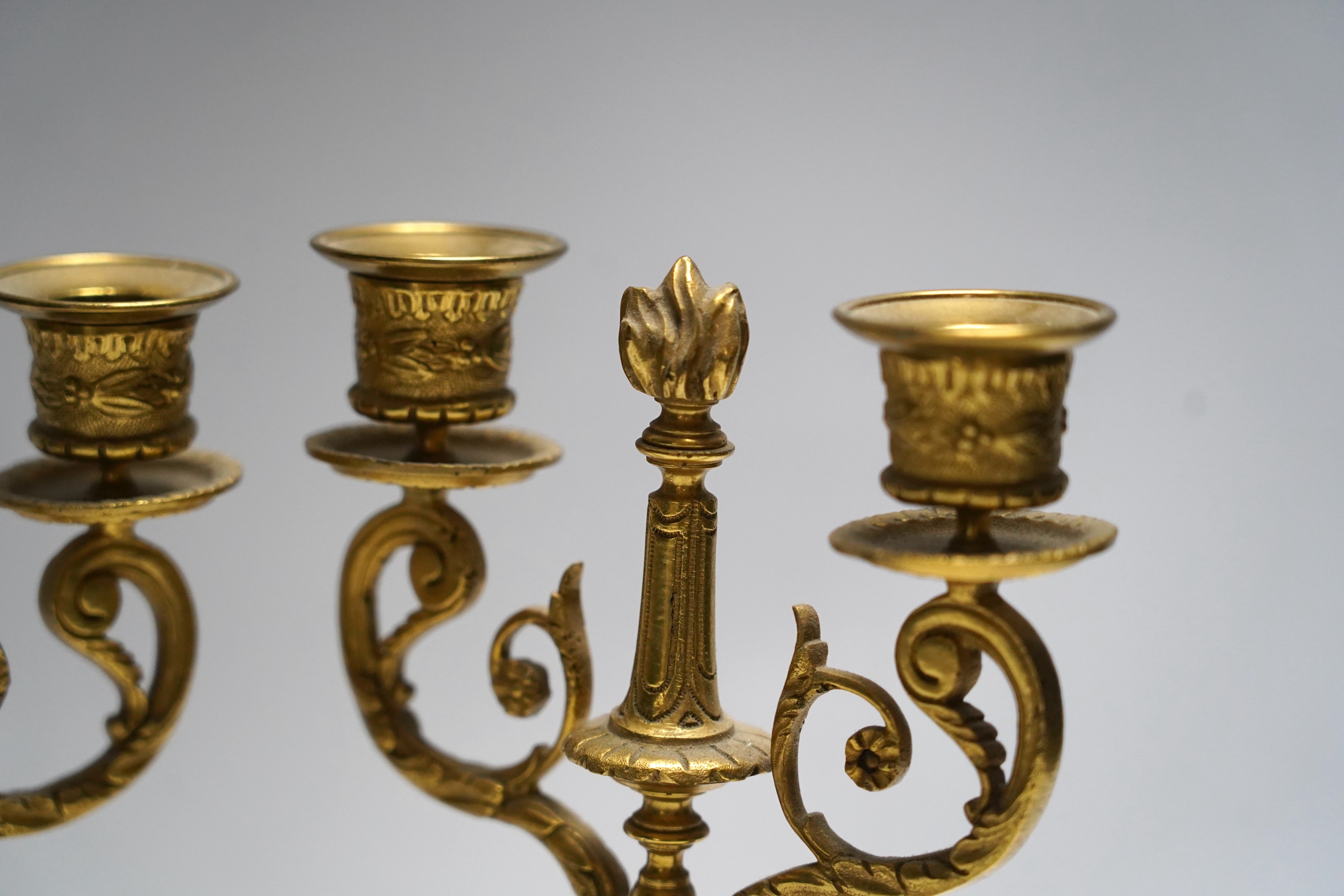 A pair of late 19th century alabaster and gilt metal two light candelabra, 22cm. Condition - good